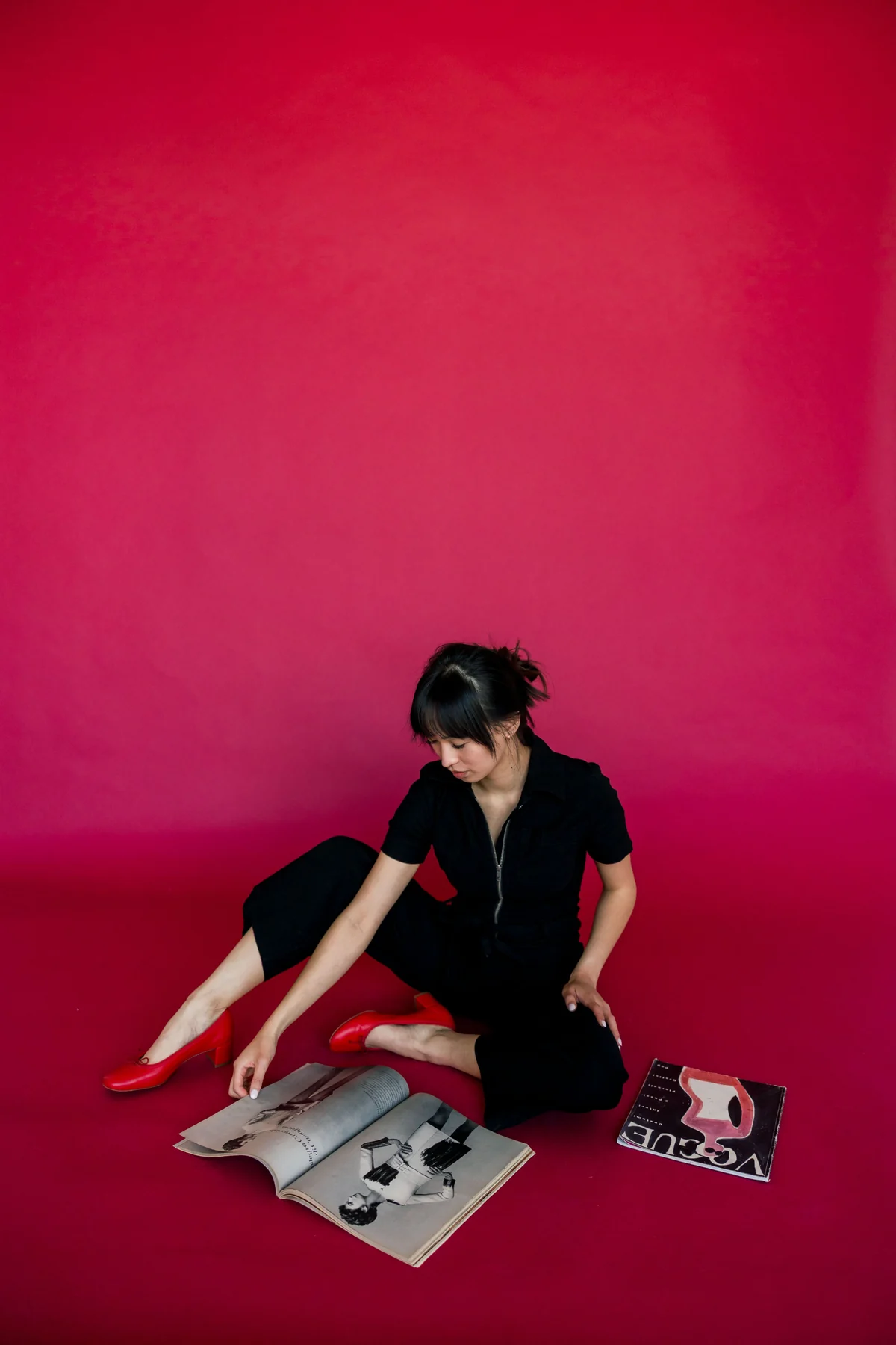 Fashion editorial portrait with a sculptural black silhouette