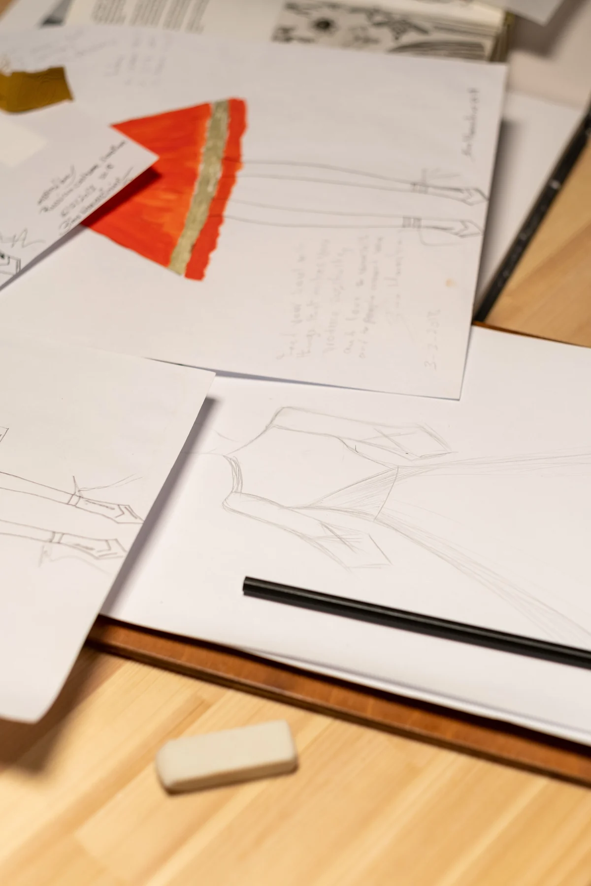 Close view of fashion sketches and design notes